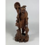 A VINTAGE ROOTWOOD STYLE CARVED ORIENTAL FIGURE, HEIGHT 21CM