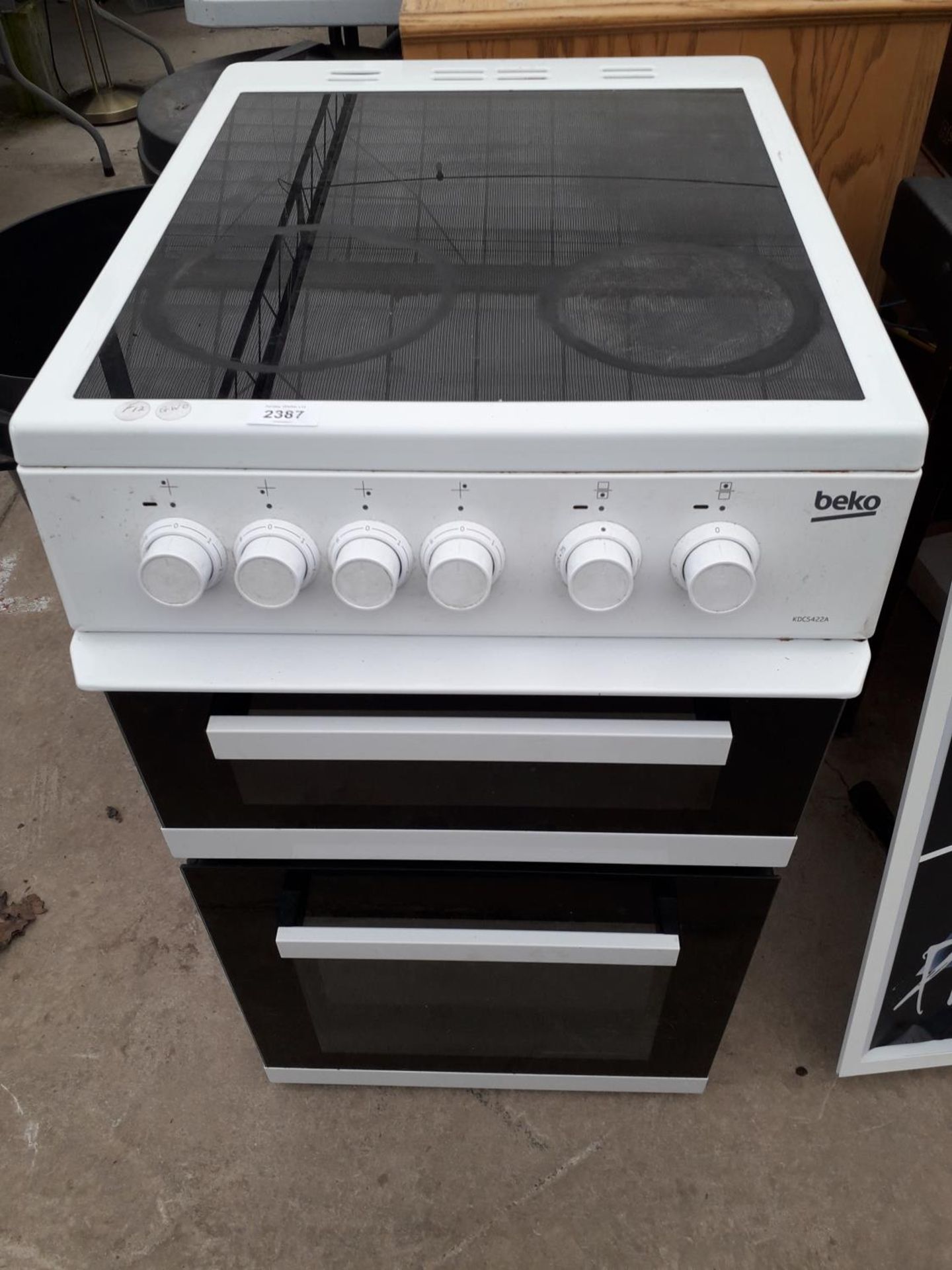 A WHITE BEKO FREESTANDING ELECTRIC OVEN AND HOB BELIEVED WORKING BUT NO WARRANTY