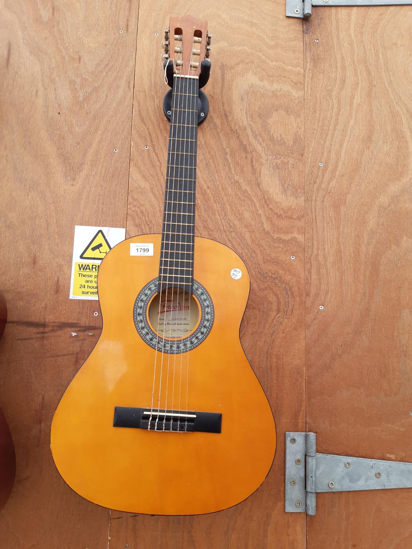 A FREEDOM ACOUSTIC GUITAR