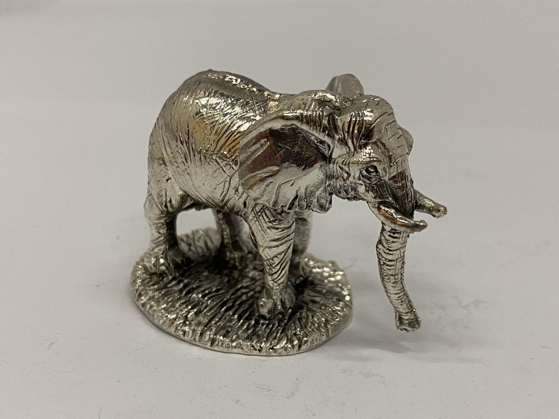 A HALLMARKED SILVER FILLED CAMELOT SILVERWARE LTD ELEPHANT FIGURE