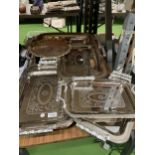 A LARGE COLLECTION OF WHITE METAL DECORATIVE TRAYS