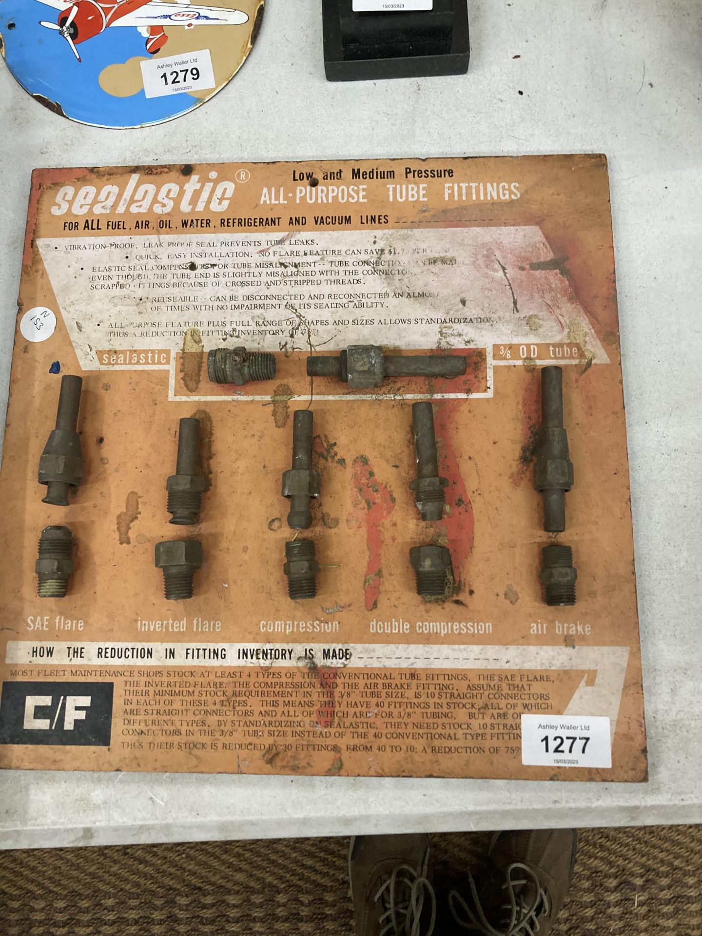 A VINTAGE 'SEALASTIC' TUBE FITTINGS BOARD WITH SAMPLES OF FITTINGS