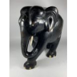 A LARGE HEAVY ANTIQUE EBONISED WOODEN ELEPHANT MODEL, HEIGHT 38CM