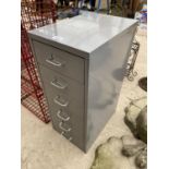 A MINIATURE SIX DRAWER METAL FILING CABINET