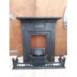 A HEAVY CAST IRON FIRE SURROUND, FIRE GRATE AND FRONT AND FURTHER DECORATIVE FIRE FENDER