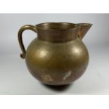 AN UNUSUAL HEAVY BRASS JUG OF SPHERICAL BASE, HEIGHT 16CM