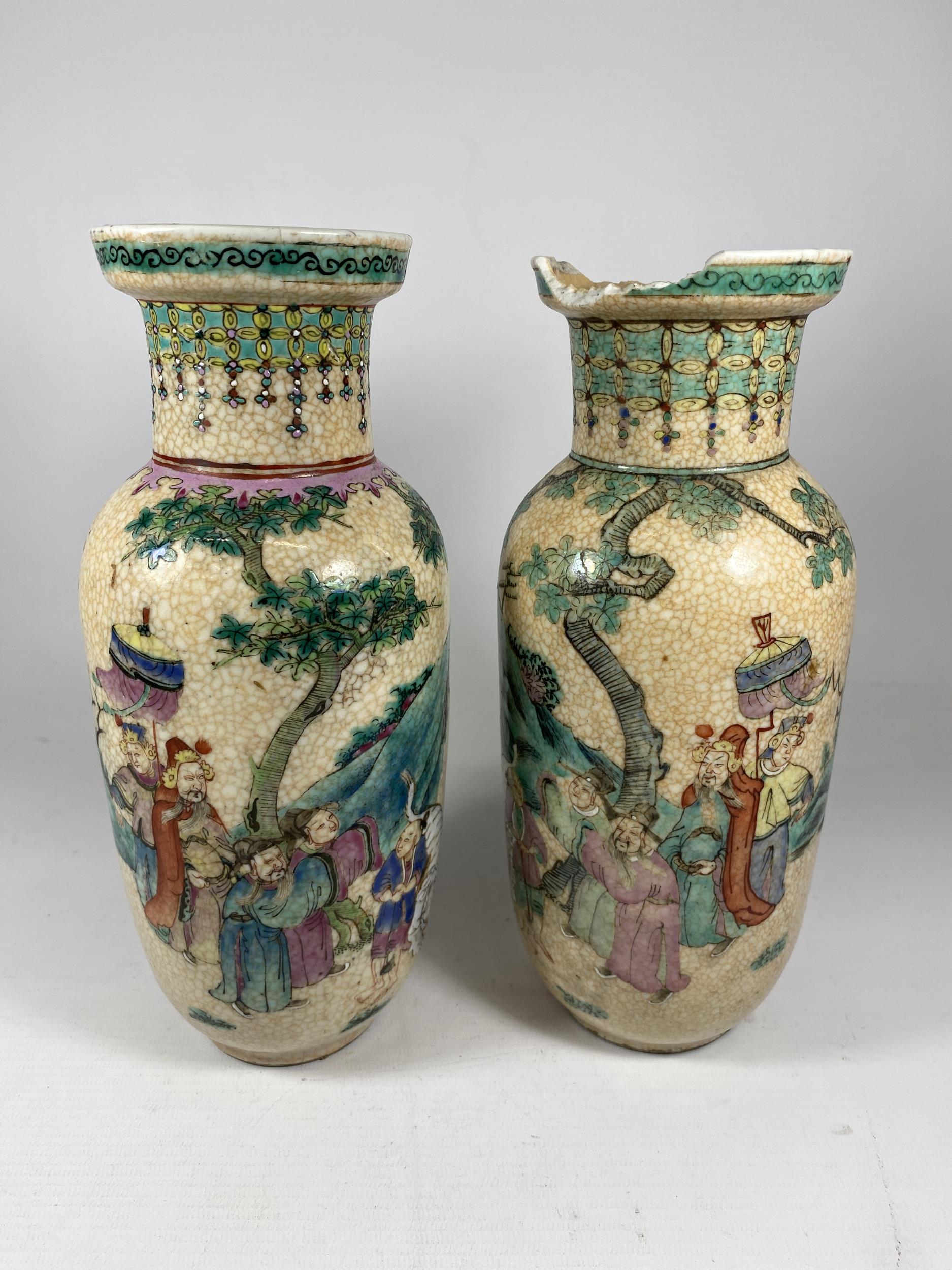 TWO 19TH CENTURY CHINESE CRACKLE GLAZE PORCELAIN WARRIOR DESIGN VASES, HEIGHT 25.5CM (A/F)