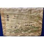 AN ORIENTAL SILK HANGING DEPICTING STORKS IN A GARDEN LANDSCAPE 70 X 92CM