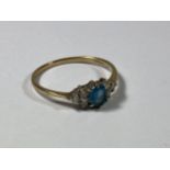 A 9CT GOLD BLUE TOPAZ & CZ RING, WEIGHT 1.1G