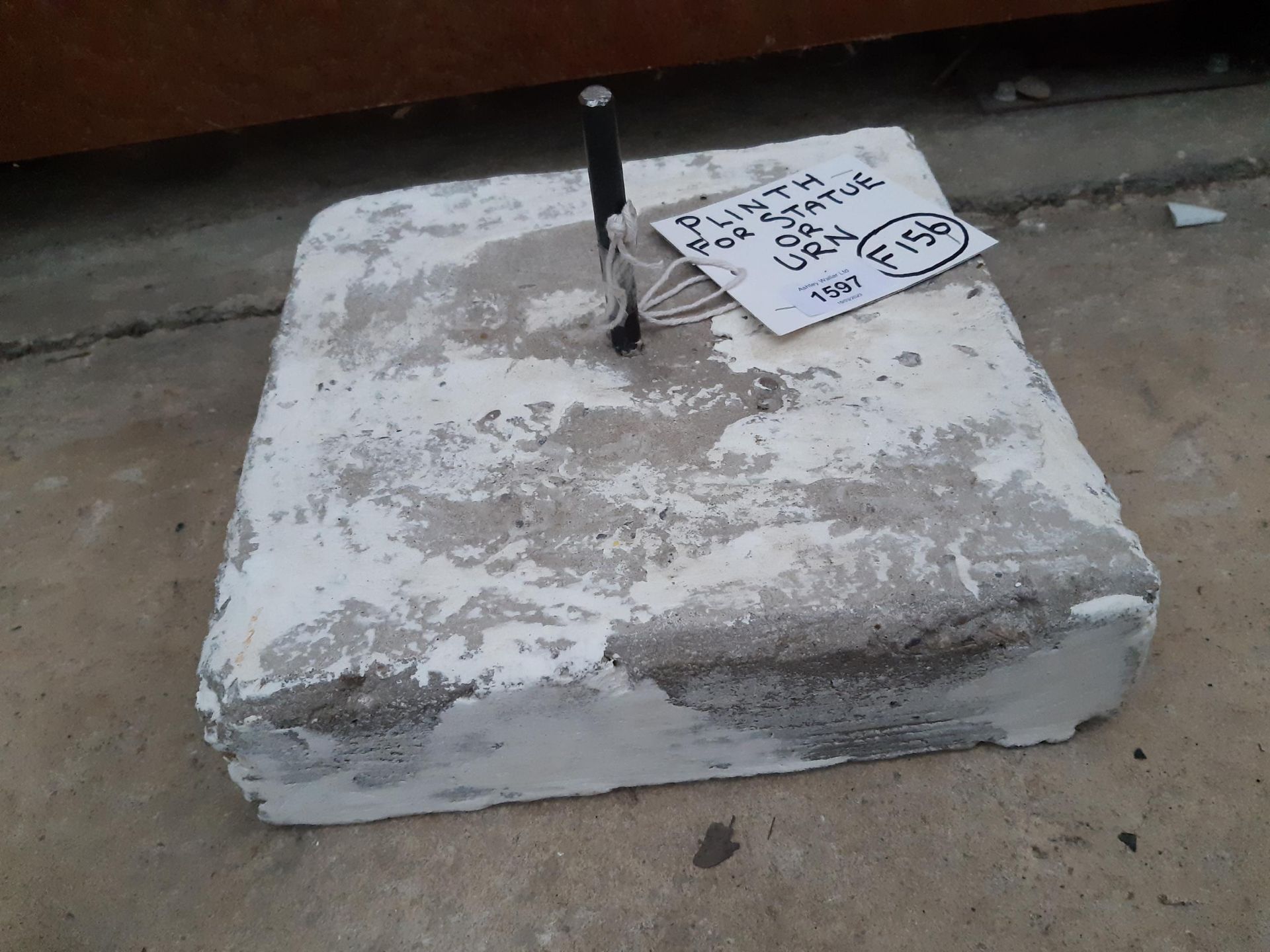 A CONCRETE PLINTH FOR A STATUE OR AN URN