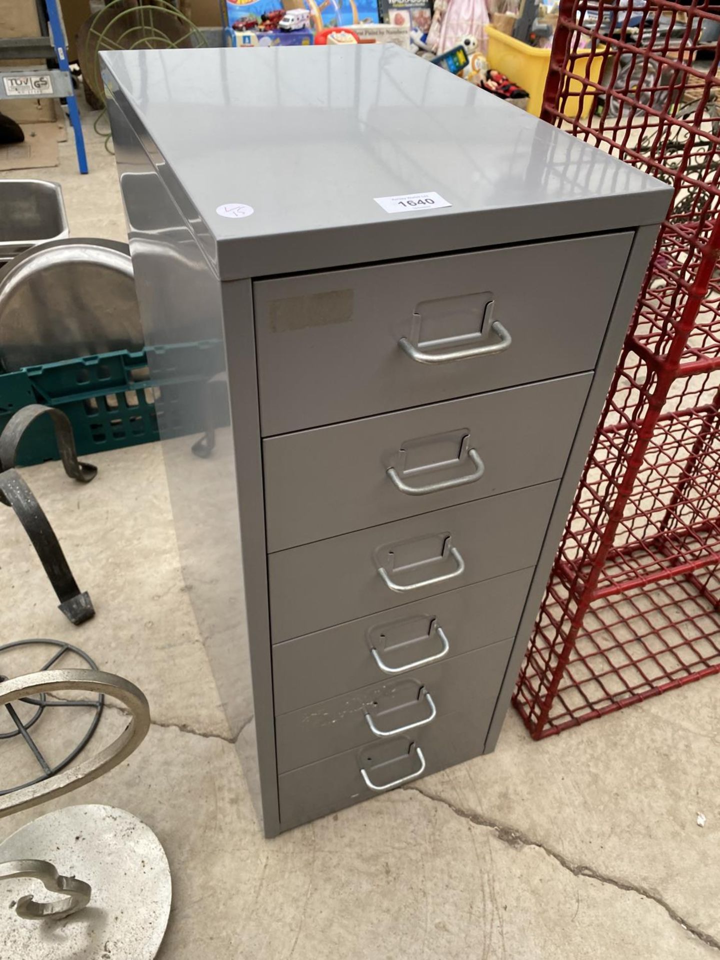 A MINIATURE SIX DRAWER METAL FILING CABINET