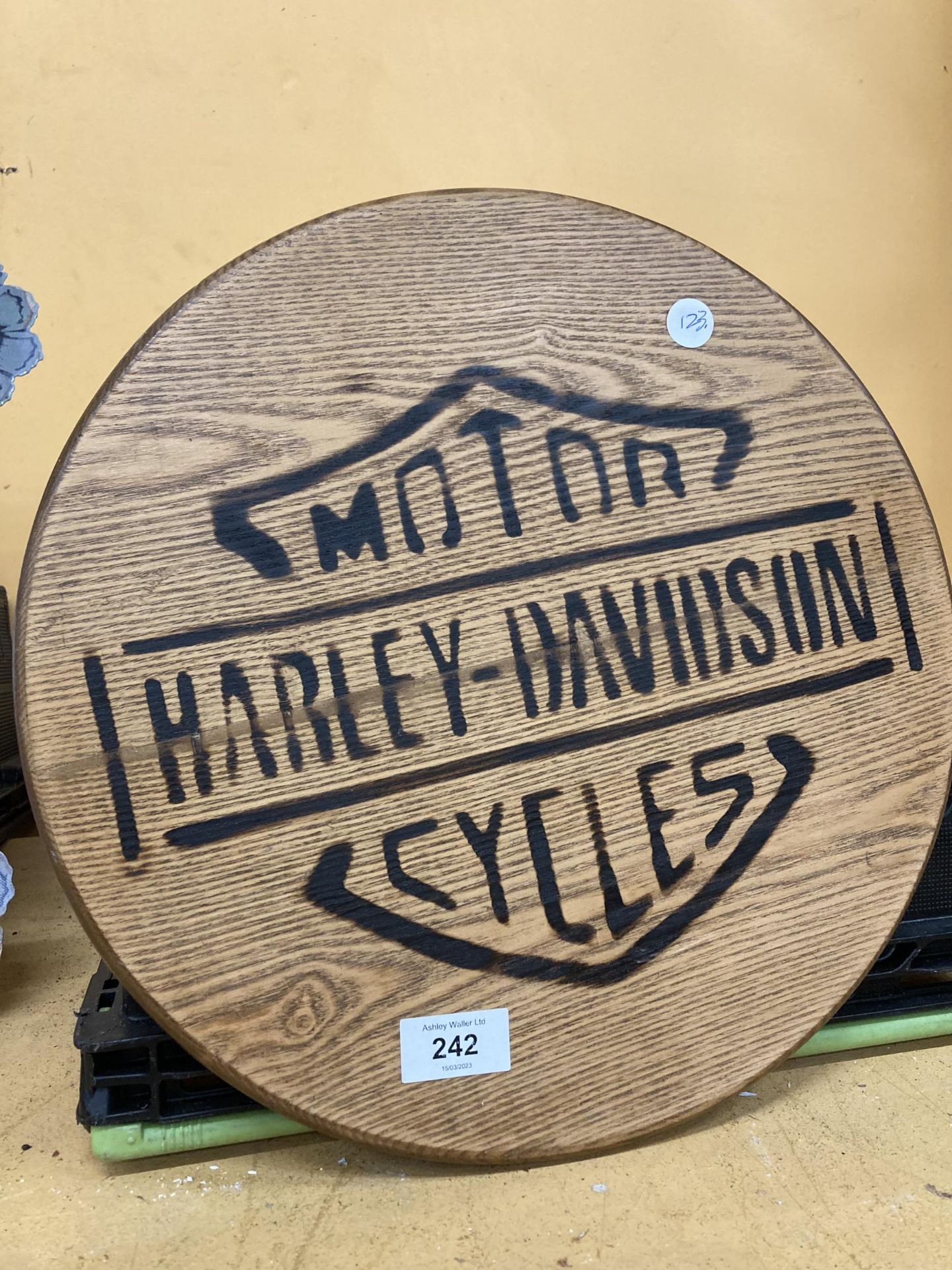 A WOODEN HARLEY DAVIDSON SIGN