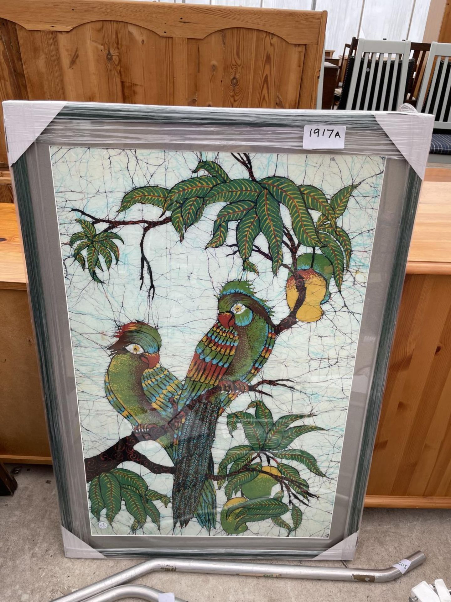 A FRAMED PRINT OF TWO PARROTS