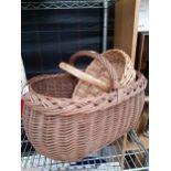 A WICKER BREAD BASKET AND A FURTHER WICKER TRUG