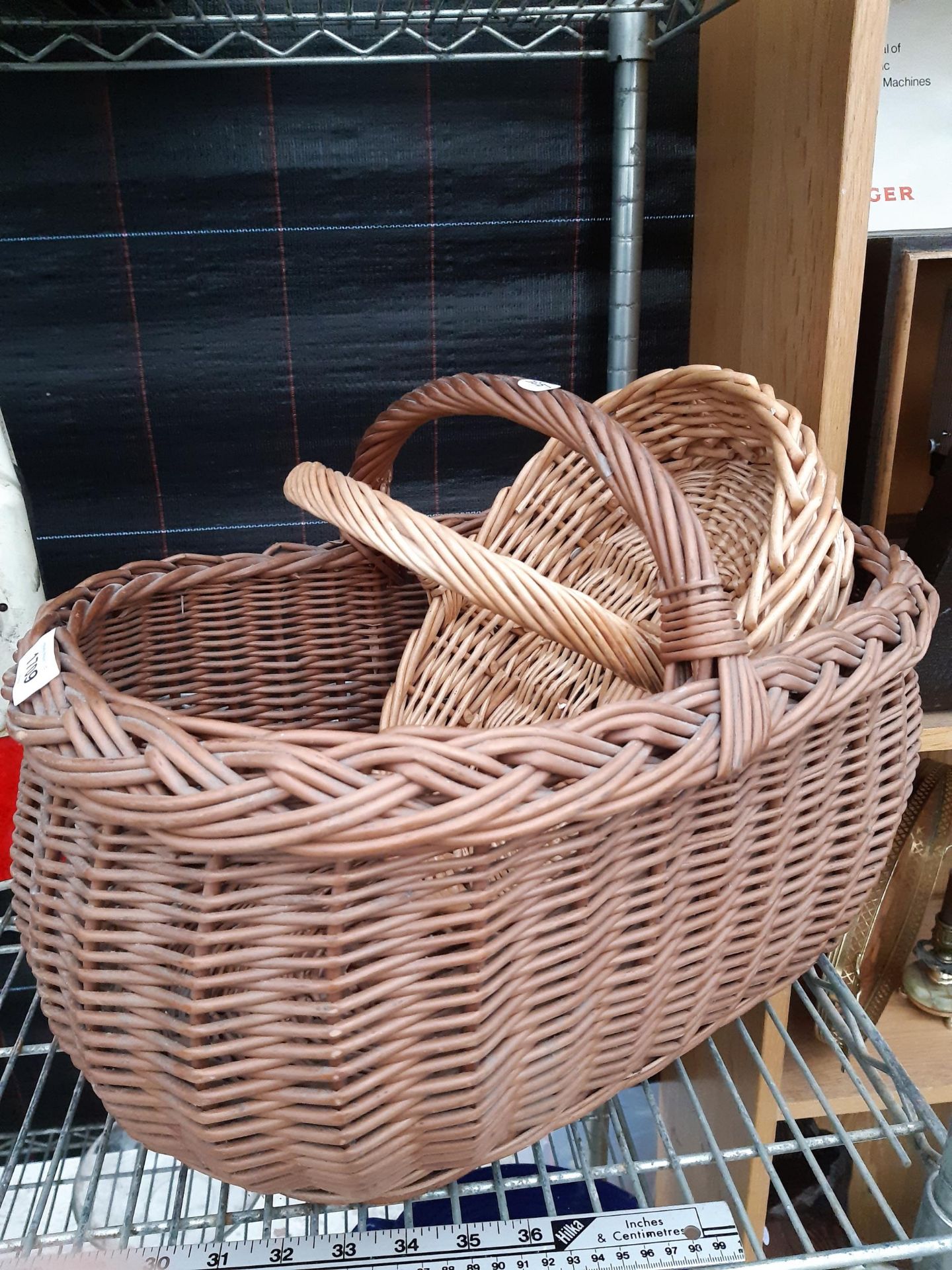 A WICKER BREAD BASKET AND A FURTHER WICKER TRUG