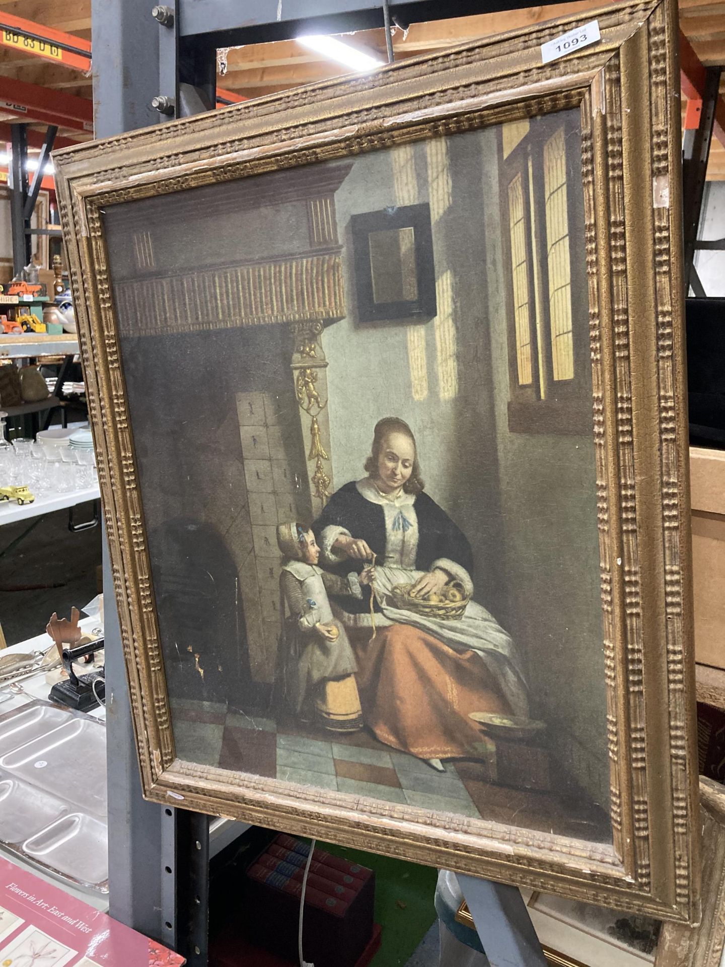 A GILT FRAMED PRINT OF A MOTHER AND CHILD