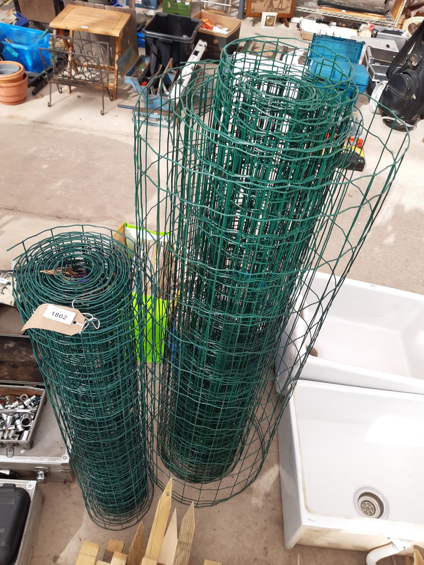 TWO PART ROLLS OF GREEN MESH FENCING WIRE