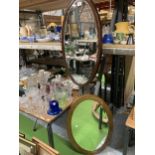 TWO MAHOGANY FRAMED VINTAGE OVAL MIRRORS WITH BEVELLED GLASS 44CM X 72CM