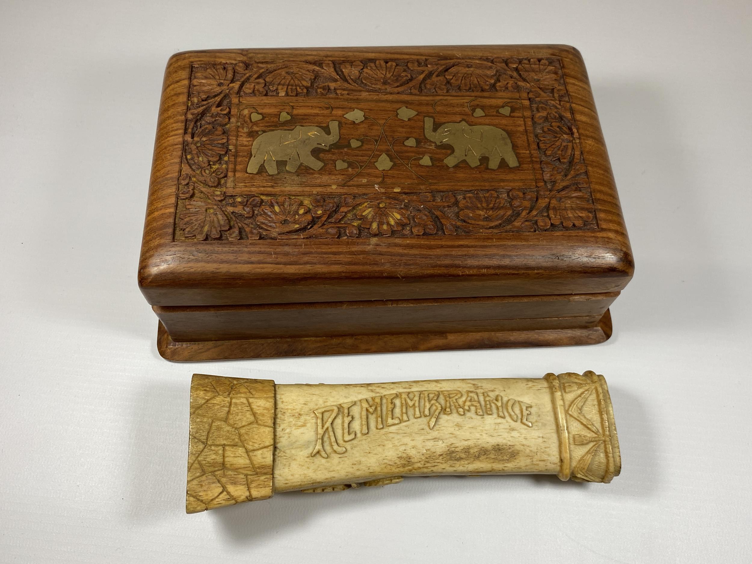 AN ANTIQUE BONE REMEMBRANCE CARVING TOGETHER WITH A CARVED WOODEN BOX