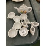 A MINIATURE CHILD'S POTTERY TEASET TO INCLUDE TEAPOT, JUGS, CUPS, ETC WITH A TEDDY BEARS PICNIC