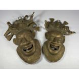 A PAIR OF UNUSUAL TRIBAL / MIDDLE EASTERN BRASS MASKS, LENGTH 27CM