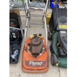 A VINTAGE FLYMO LAWNMOWER WITH PETROL ENGINE