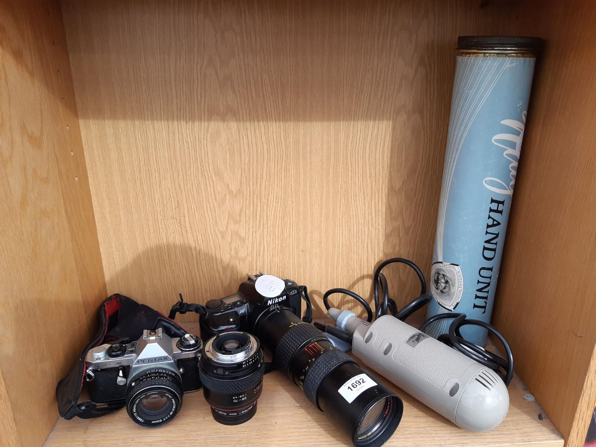 AN ASSORTMENT OF CAMERA EQUIPMENT TO INCLUDE A PENTAX CAMERA AND A BELL AND HOWELL LENS ETC