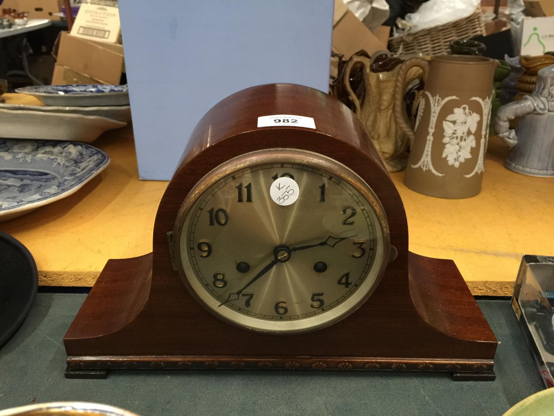 A NELSONS HAT STYLE MAHOGANY MANTLE CLOCK