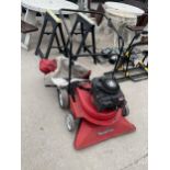 A MOUNTFIELD PETROL LEAF SWEEPER WITH 4 HP BRIGGS AND STRATTON ENGINE