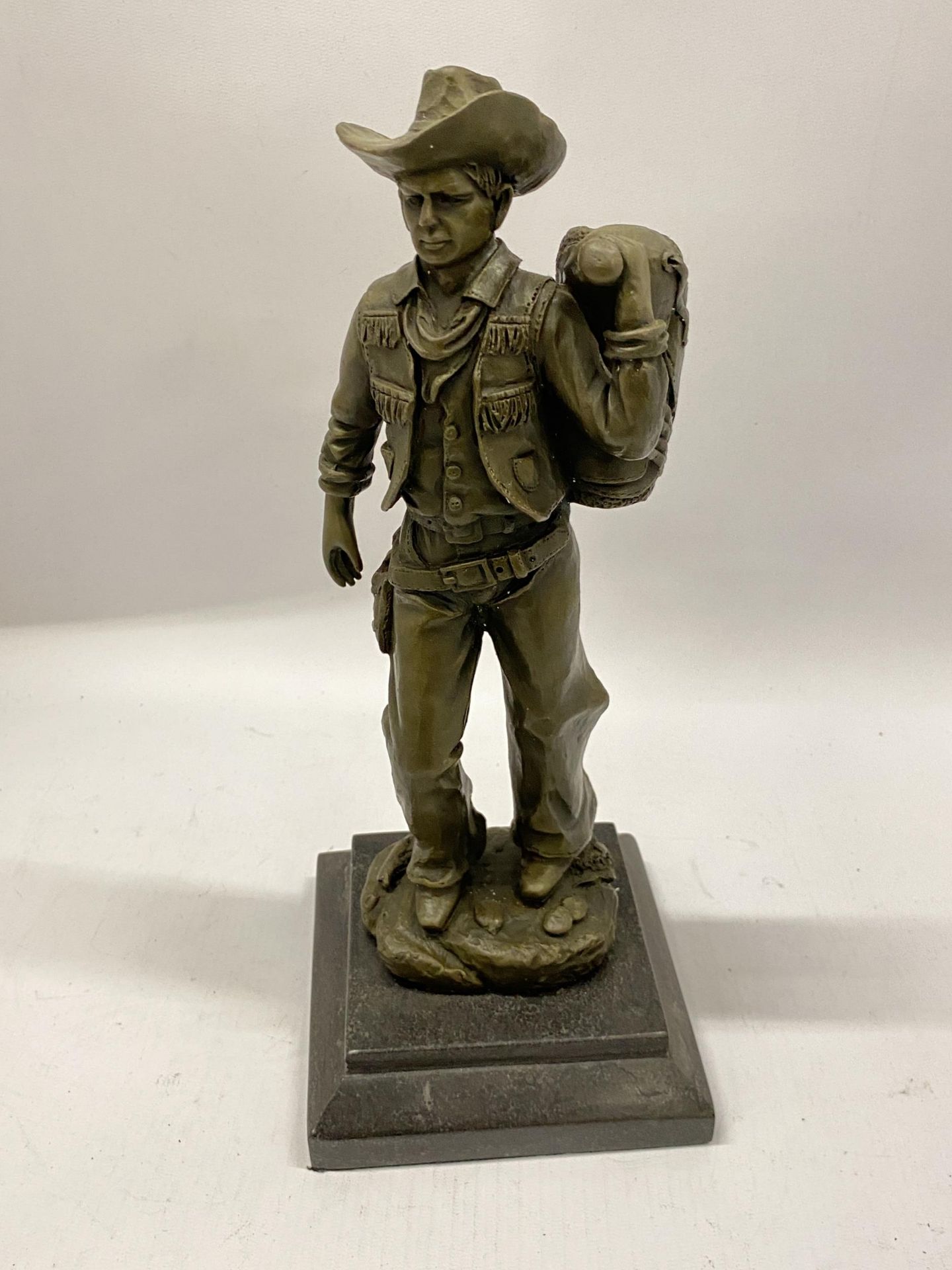 A BRONZE COWBOY FIGURE, SIGNED MILO, HEIGHT 32CM