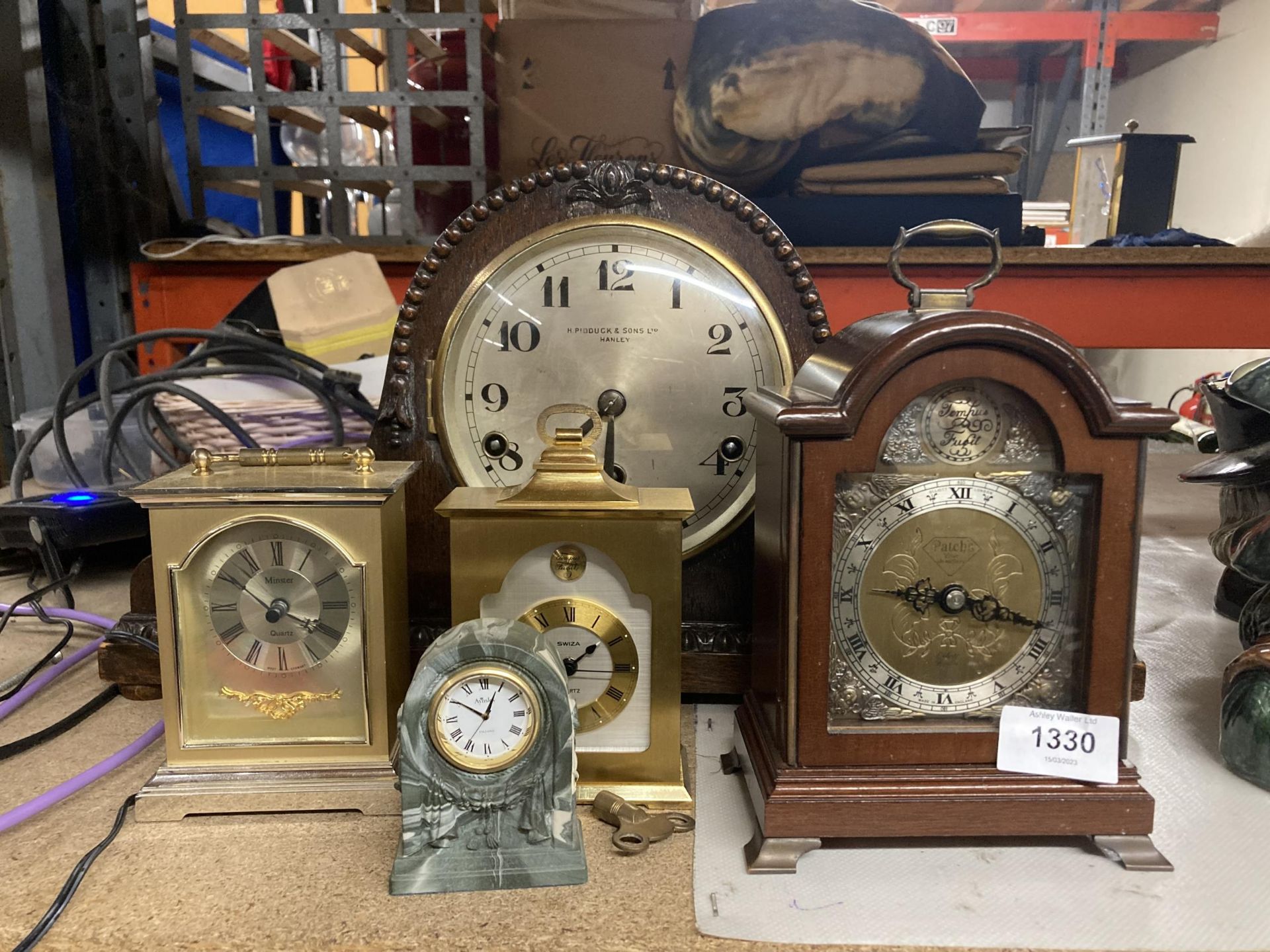 A NAPOLEON'S HAT SHAPED MAHOGANY CASED CLOCK BY H PIDDUCK & SONS LTD HANLEY TOGETHER WITH FOUR