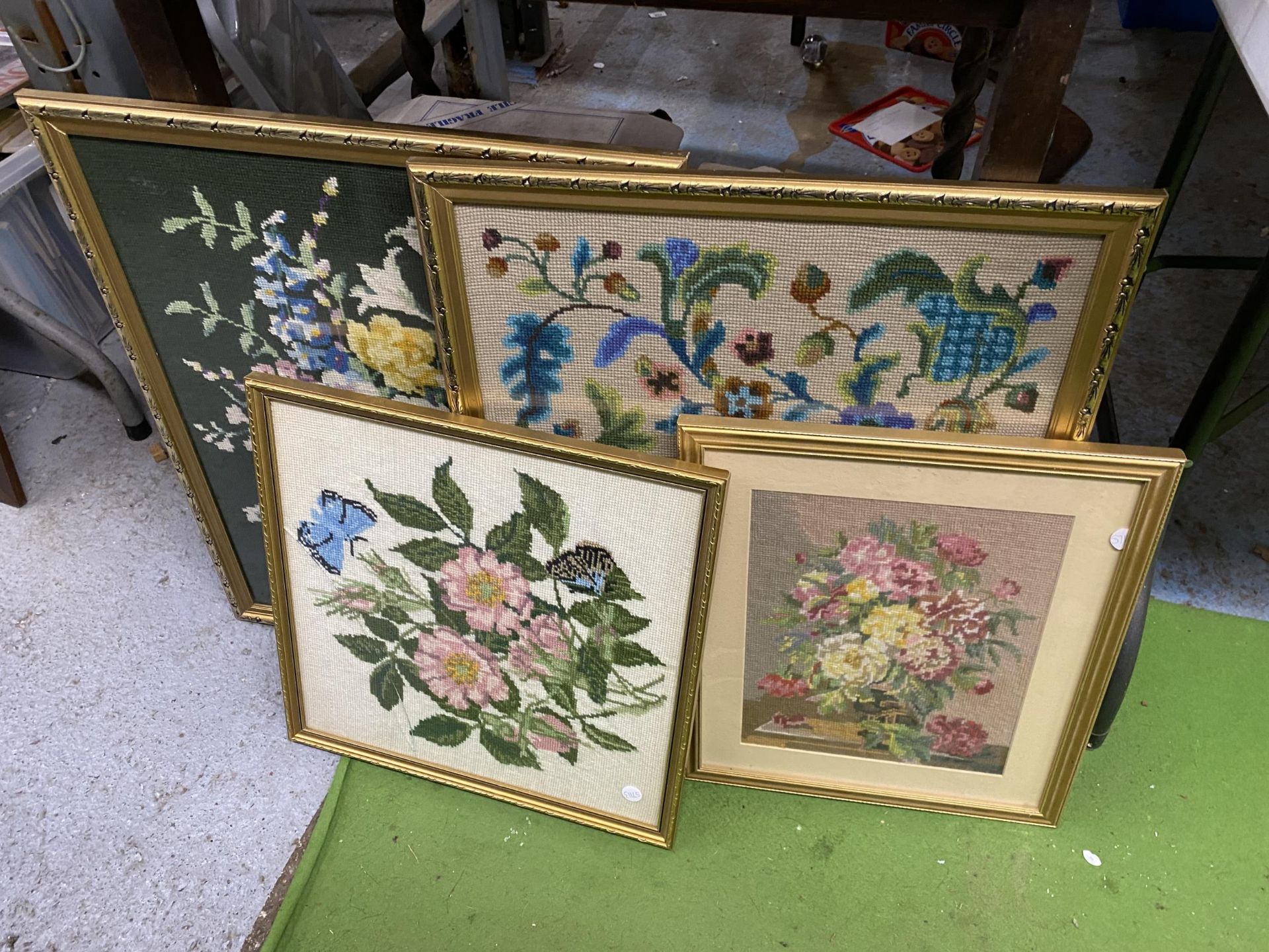 FOUR GILT FRAMED FLORAL WOOLWORK PICTURES