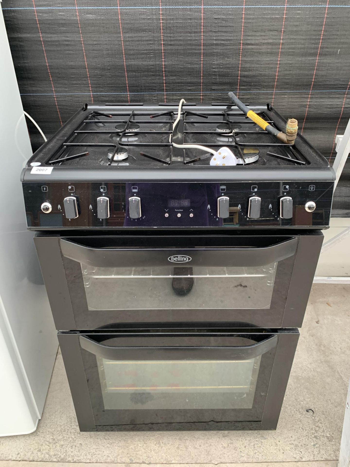 A BLACK BELLING DUEL FUEL COOKER AND HOB