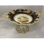 A VICTORIAN FOOTED COMPORT WITH COBALT BLUE, GOLD FILIGREE AND TRANSFER PRINTED SCENE, HEIGHT 17CM