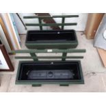 TWO WOODEN TROUGH PLANTERS WITH PLASTIC INSERTS AND TRELIS BACK