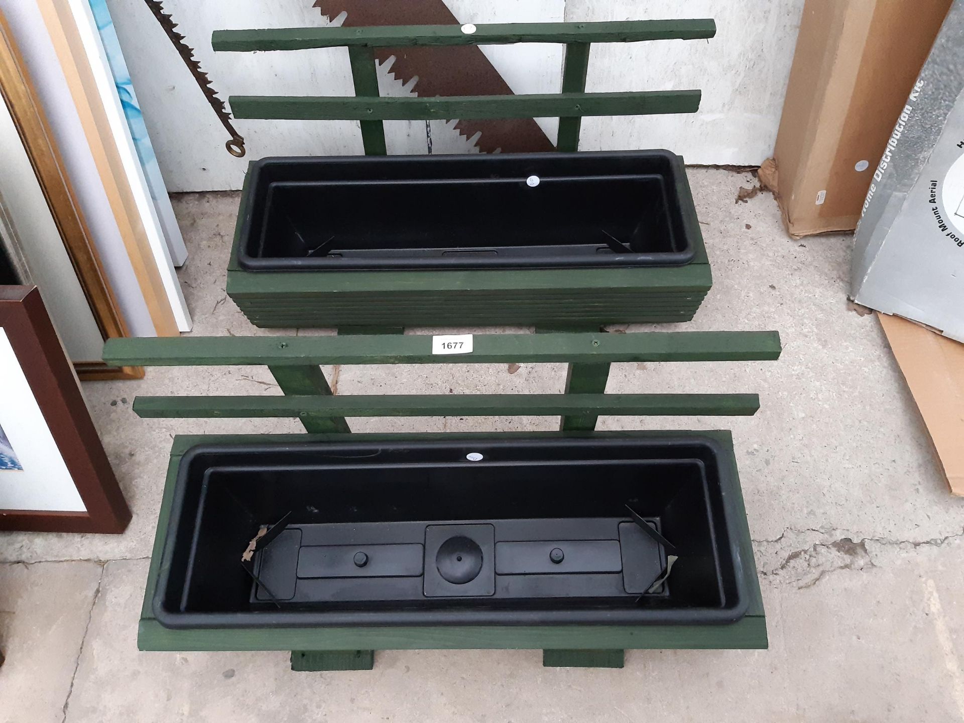 TWO WOODEN TROUGH PLANTERS WITH PLASTIC INSERTS AND TRELIS BACK