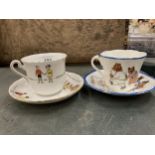 TWO CHINA NURSERY CUPS AND SAUCERS