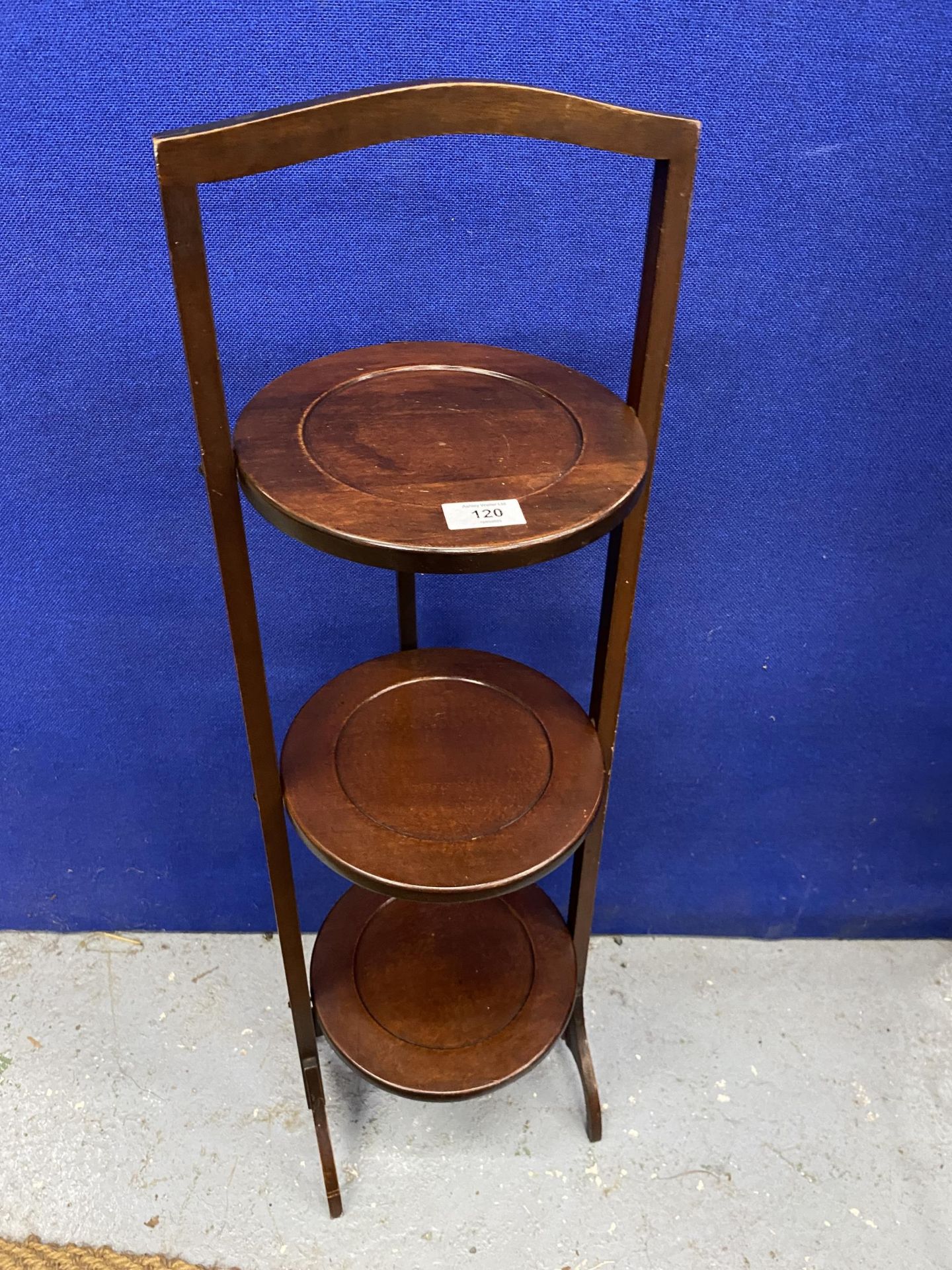 A VINTAGE THREE TIER FOLDING WOODEN CAKE STAND