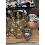 A LARGE QUANTITY OF BRASSWARE TO INCLUDE AN OIL LAMP, CANDLESTICKS, WEIGHING SCALES, ETC.,