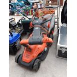 A BLACK AND DECKER ELECTRIC LAWN MOWER WITH GRASS BOX