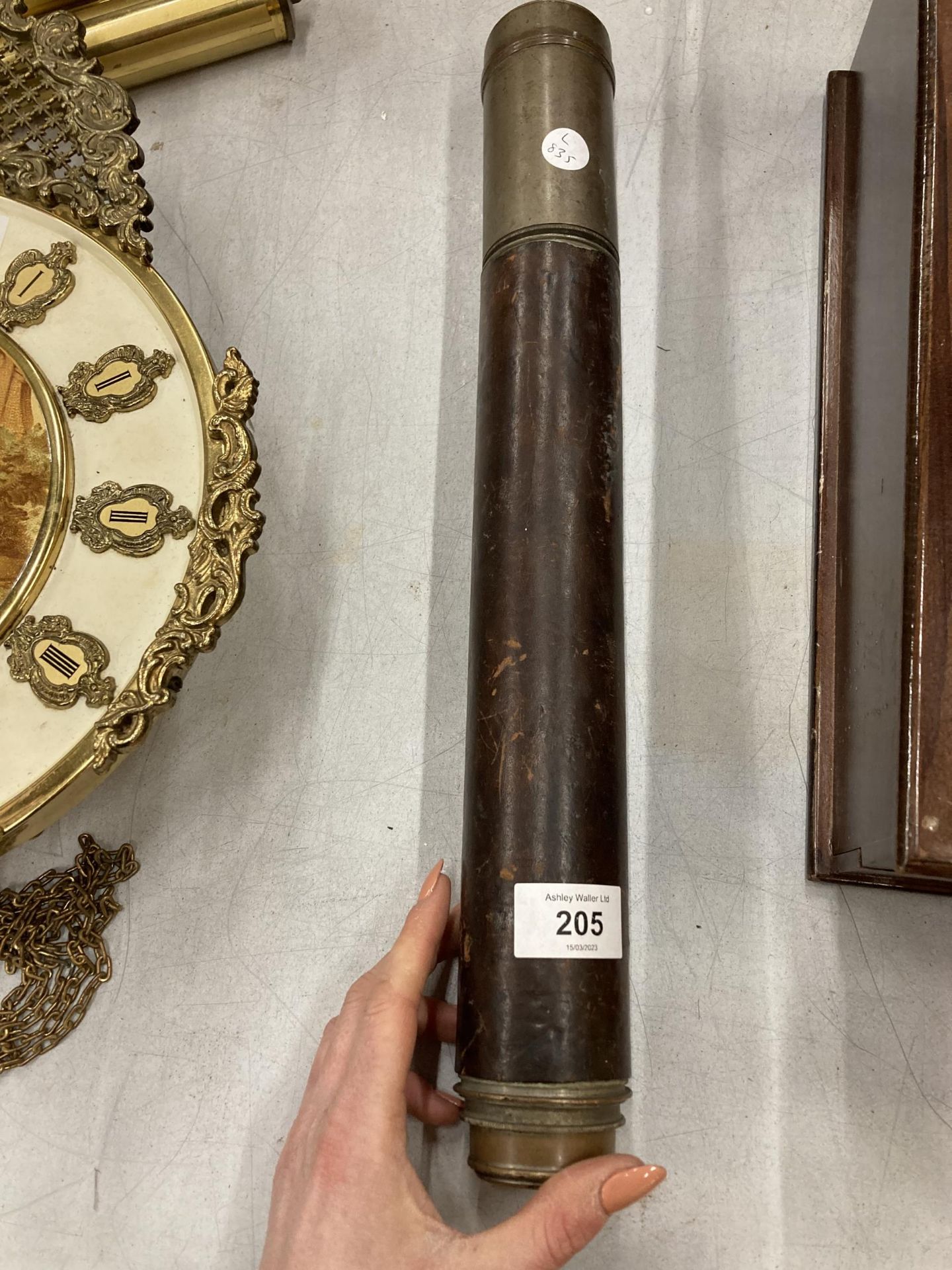 A VINTAGE LEATHER BOUND TELESCOPE