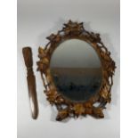 A VINTAGE CARVED WOODEN MIRROR WITH MATCHING LETTER OPENER, MIRROR LENGTH 40CM