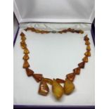 AN AMBER NECKLACE IN A PRESENTATION BOX