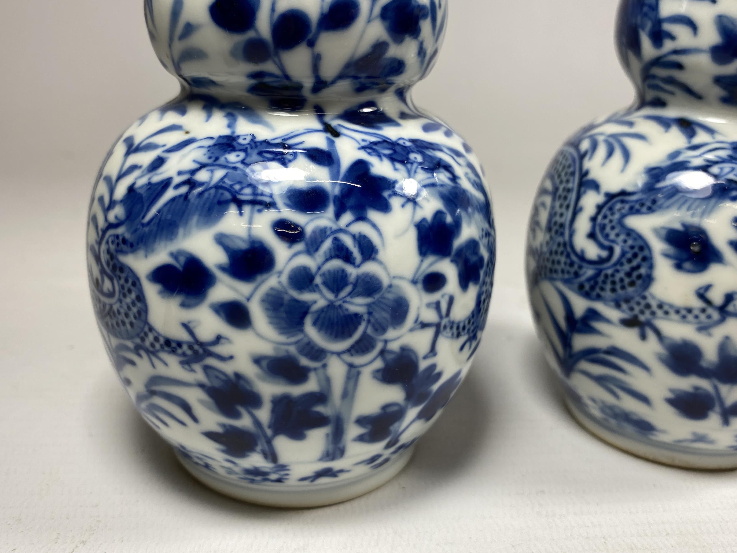 A PAIR OF QING 19TH CENTURY CHINESE BLUE AND WHITE KANGXI STYLE DOUBLE GOURD VASES, FOUR CHARACTER - Image 2 of 9