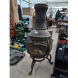 A METAL GARDEN CHIMENEA