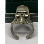 A SILVER SKULL RING IN A PRESENTATION BOX