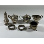 A COLLECTION OF HALLMARKED SILVER ITEMS, CONDIMENT SET, SMALL TROPHY AND A/F NAPKIN RINGS