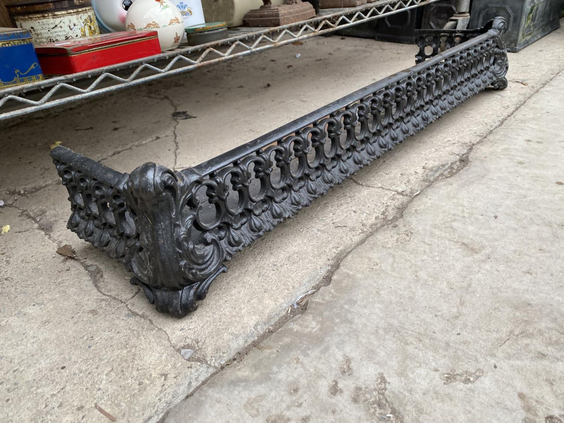 A DECORATIVE METAL FIRE FENDER