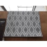 A MODERN GREY PATTERNED RUG