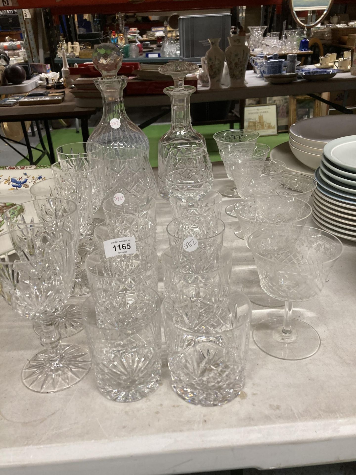 A QUANTITY OF GLASSES TO INCLUDE DECANTERS, WINE, TUMBLERS, ETC
